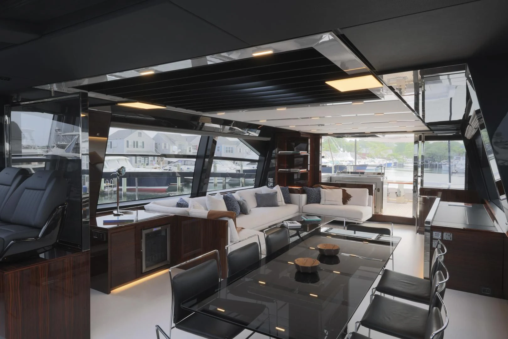 a room with a table chairs and a large window aboard OUR TRADE Yacht for Sale