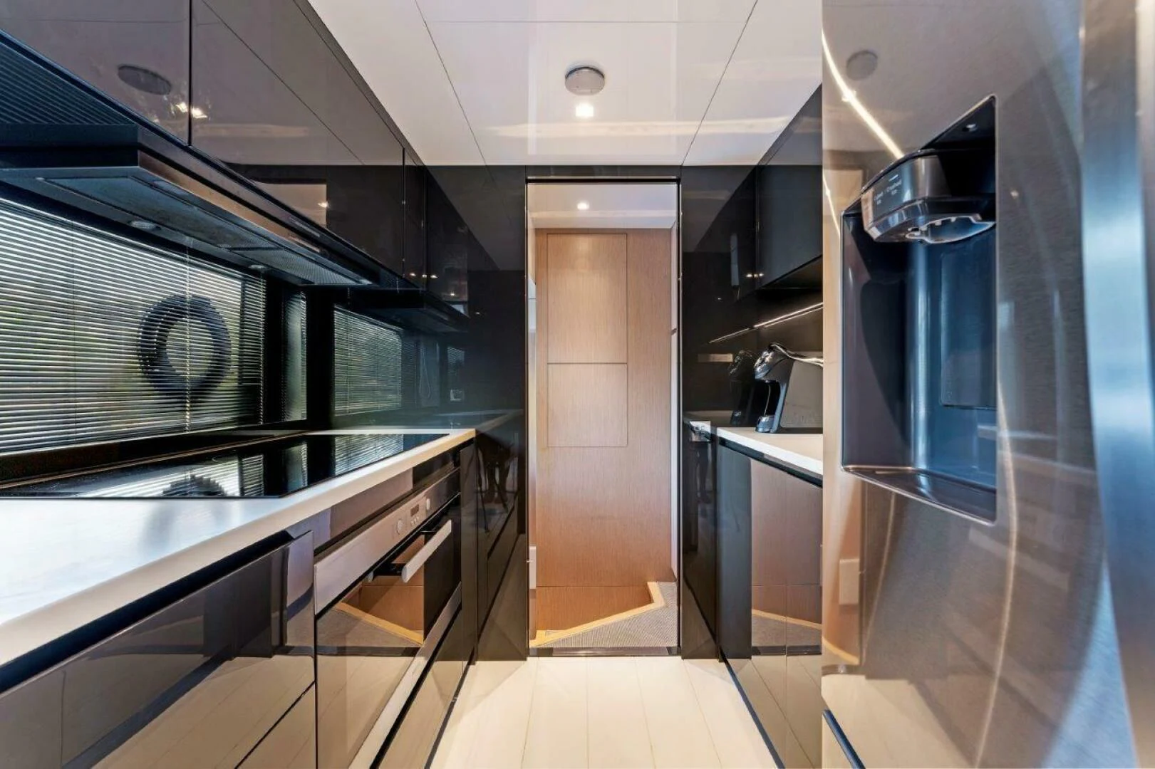 a kitchen with stainless steel appliances aboard OUR TRADE Yacht for Sale