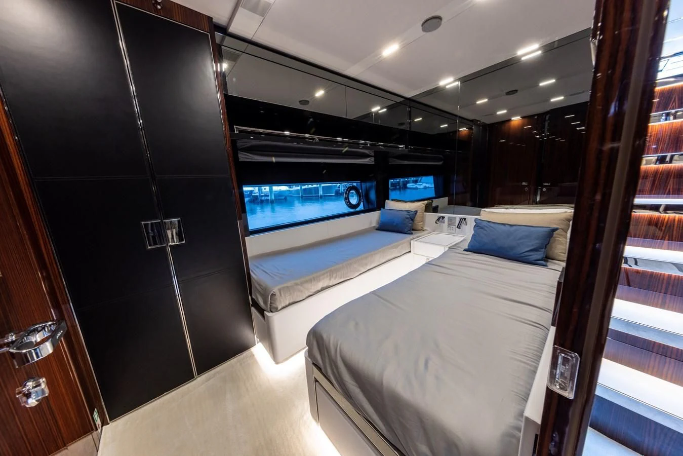 a room with a bed and a television aboard OUR TRADE Yacht for Sale