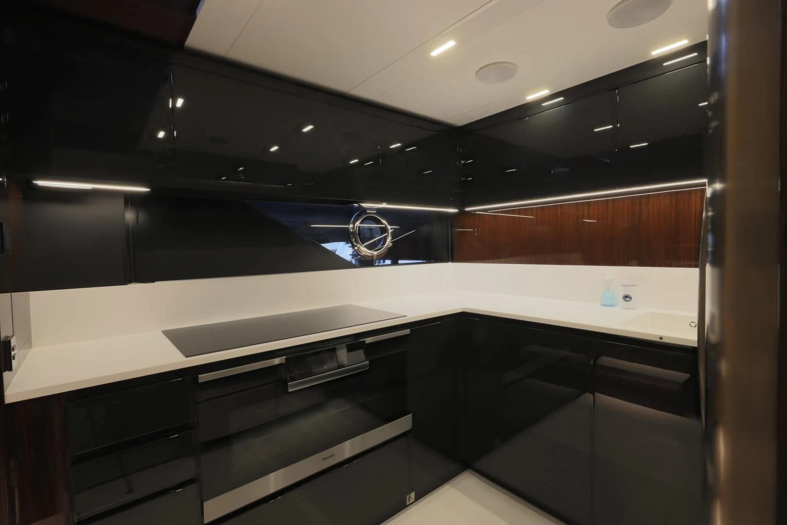 a room with a black counter and cabinets aboard OUR TRADE Yacht for Sale