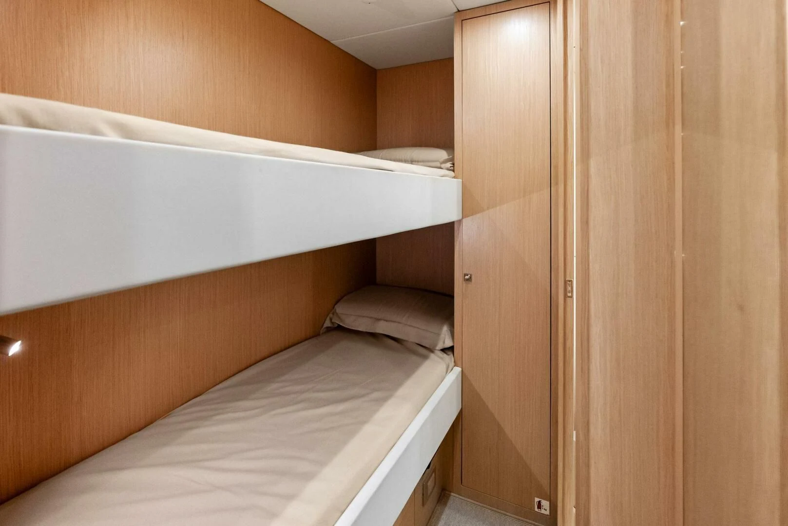 a room with a bed and a closet aboard OUR TRADE Yacht for Sale