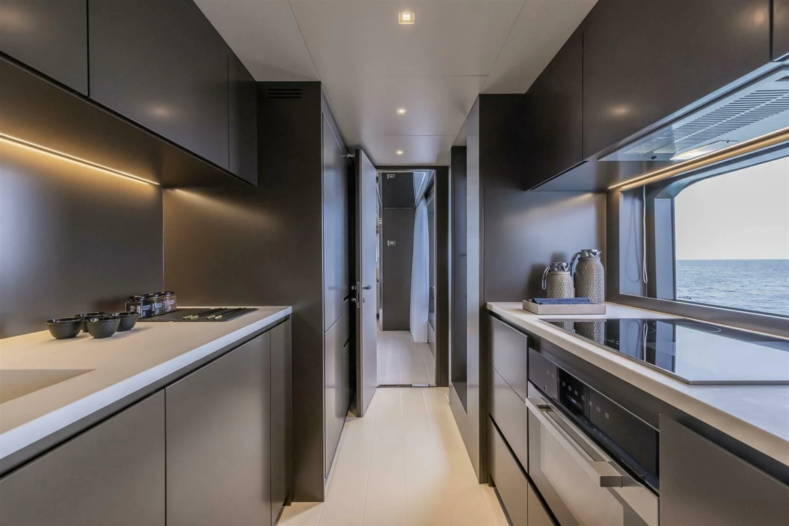 a kitchen with white cabinets aboard OUR TRADE Yacht for Sale