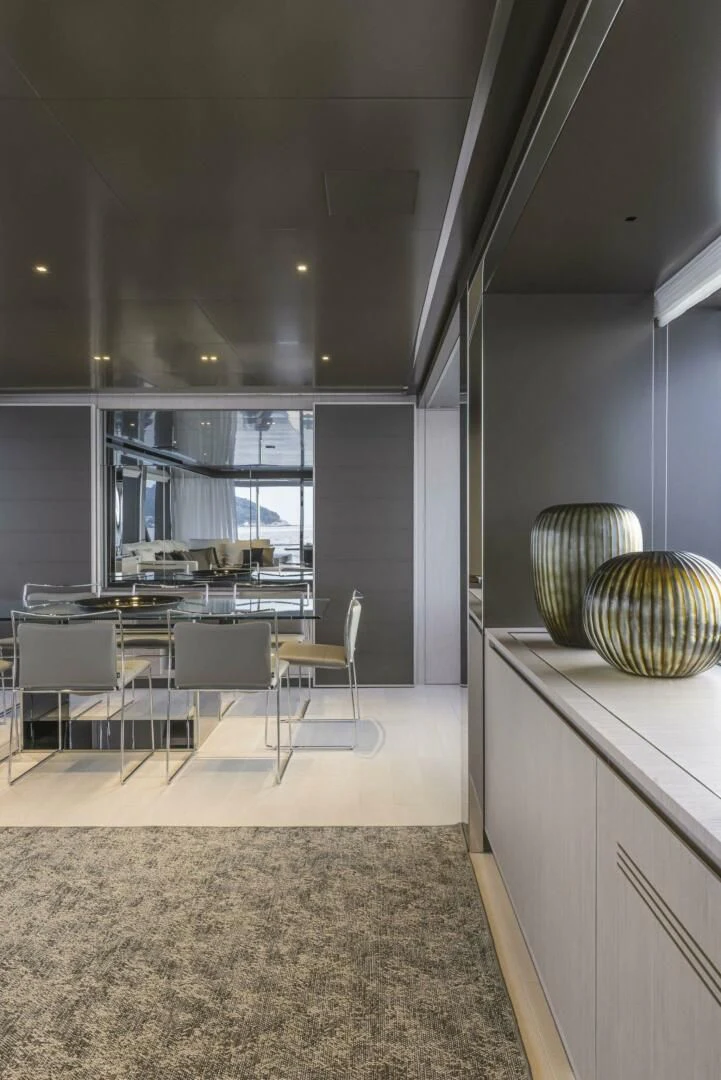 a room with a table and chairs aboard OUR TRADE Yacht for Sale
