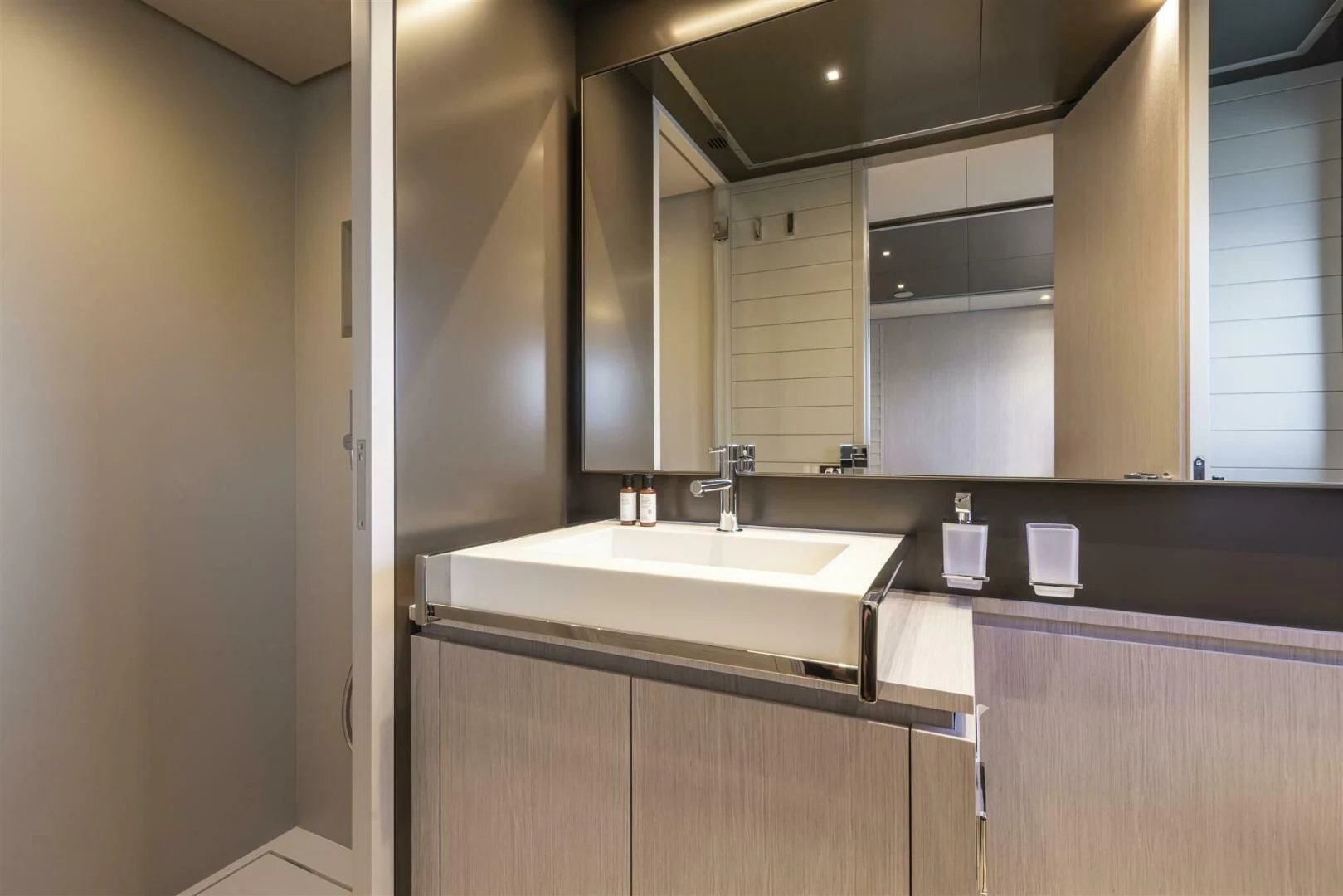 a bathroom with a sink and a mirror aboard OUR TRADE Yacht for Sale