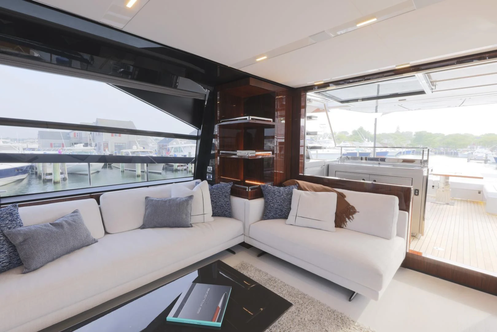a living room with a large window aboard OUR TRADE Yacht for Sale