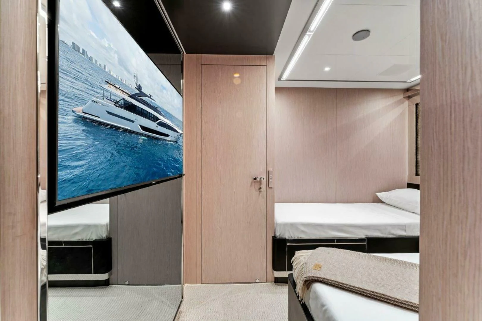 a room with a bed and a television aboard OUR TRADE Yacht for Sale