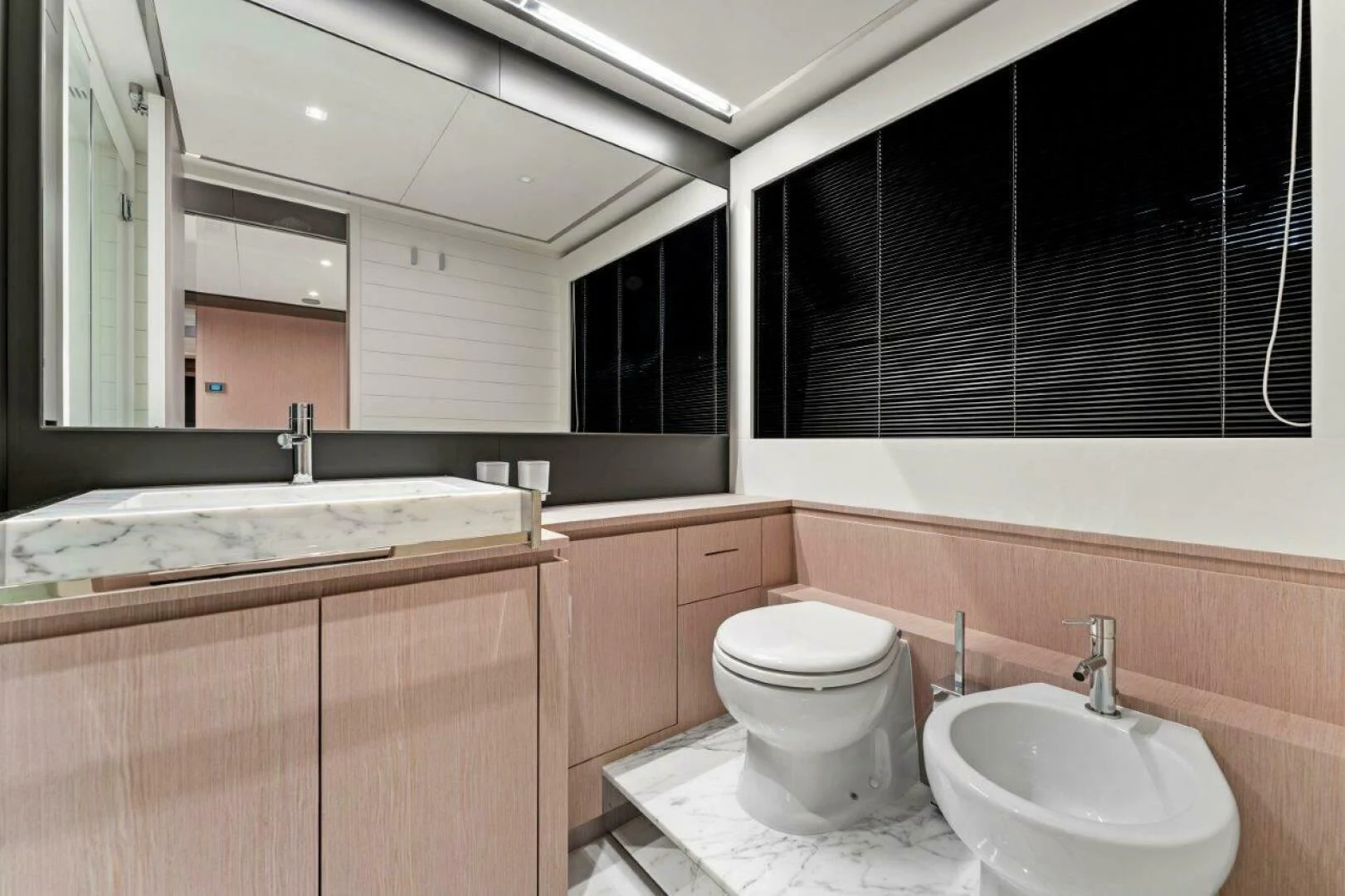 a bathroom with a sink and a toilet aboard OUR TRADE Yacht for Sale