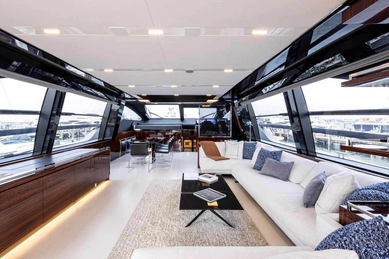 inside of a building with a couch and a table and chairs aboard OUR TRADE Yacht for Sale