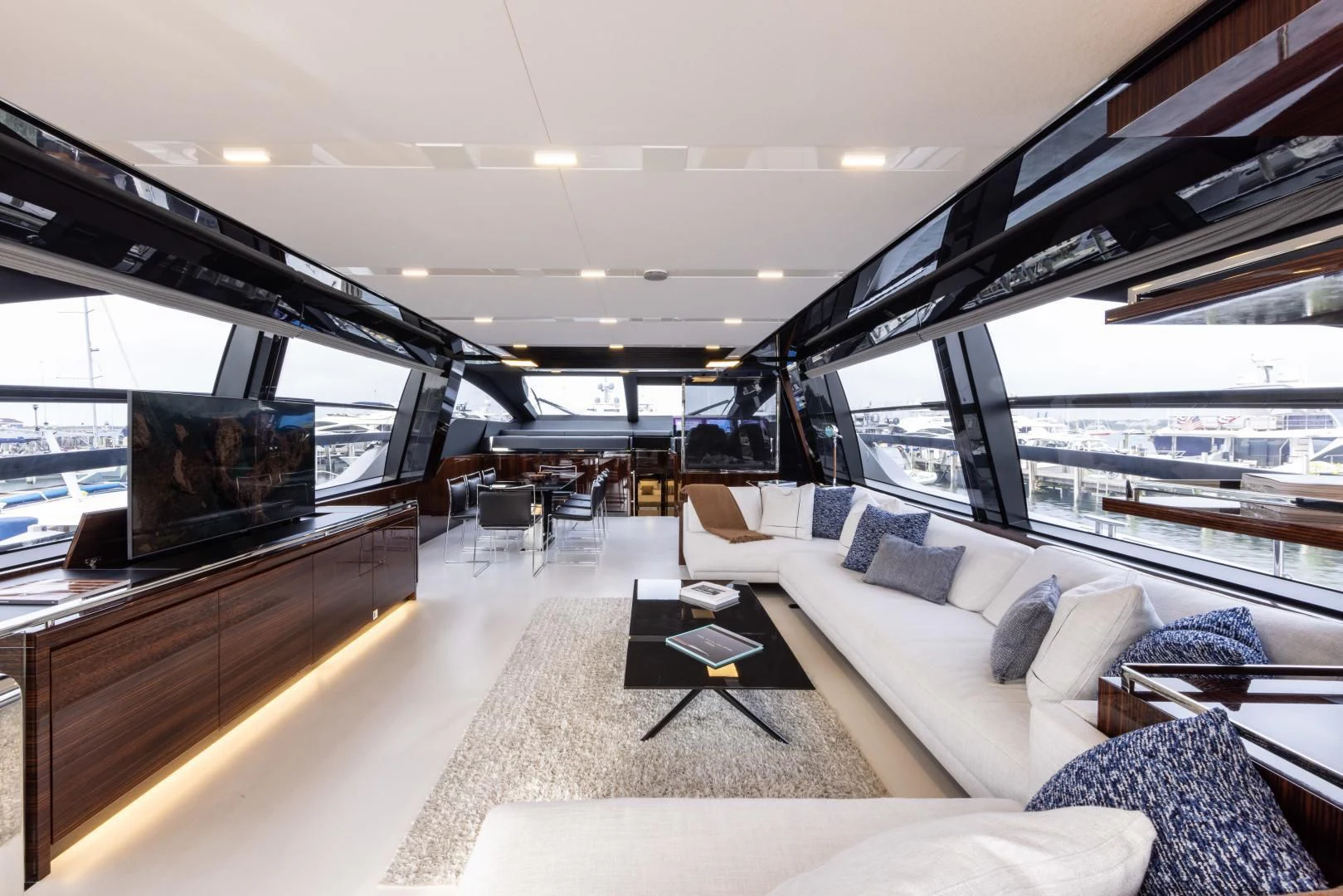 a living room with a large television aboard OUR TRADE Yacht for Sale