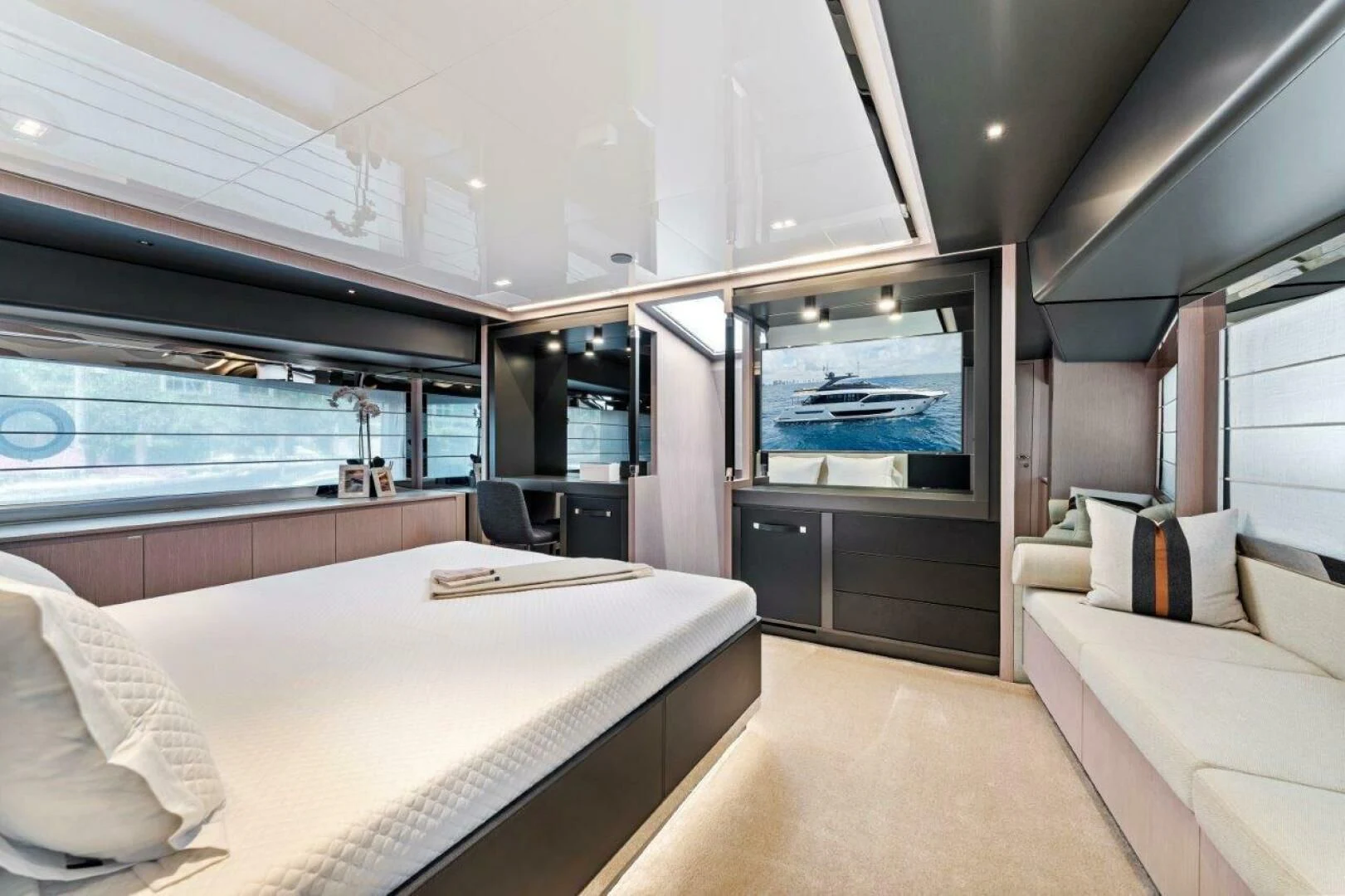 a room with a bed and a large window aboard OUR TRADE Yacht for Sale