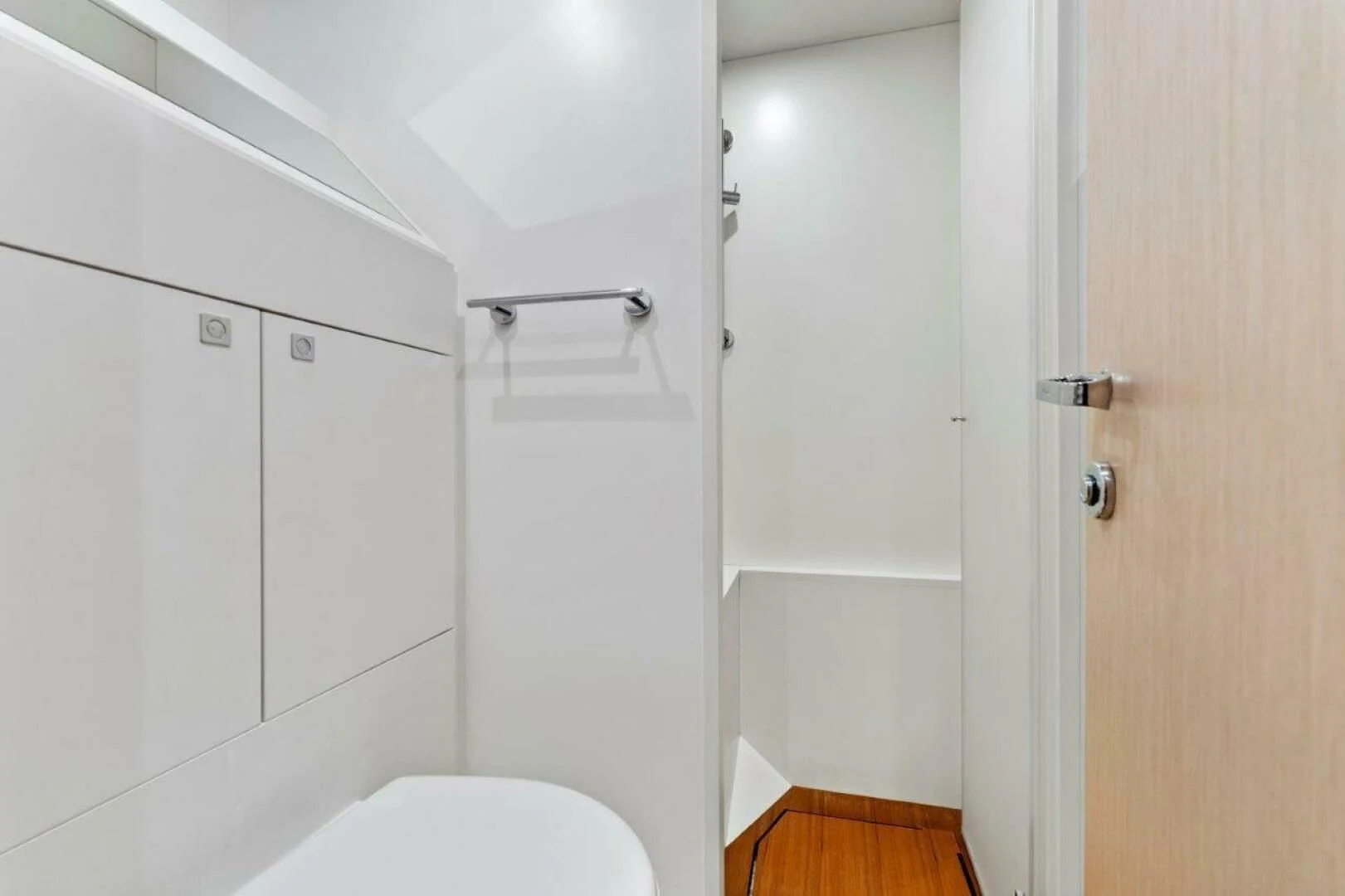 a bathroom with white walls aboard OUR TRADE Yacht for Sale