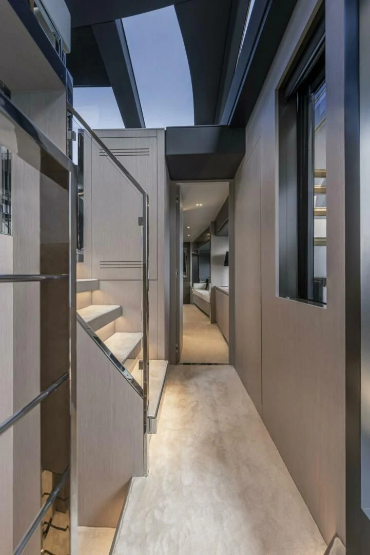 a hallway with a glass door aboard OUR TRADE Yacht for Sale