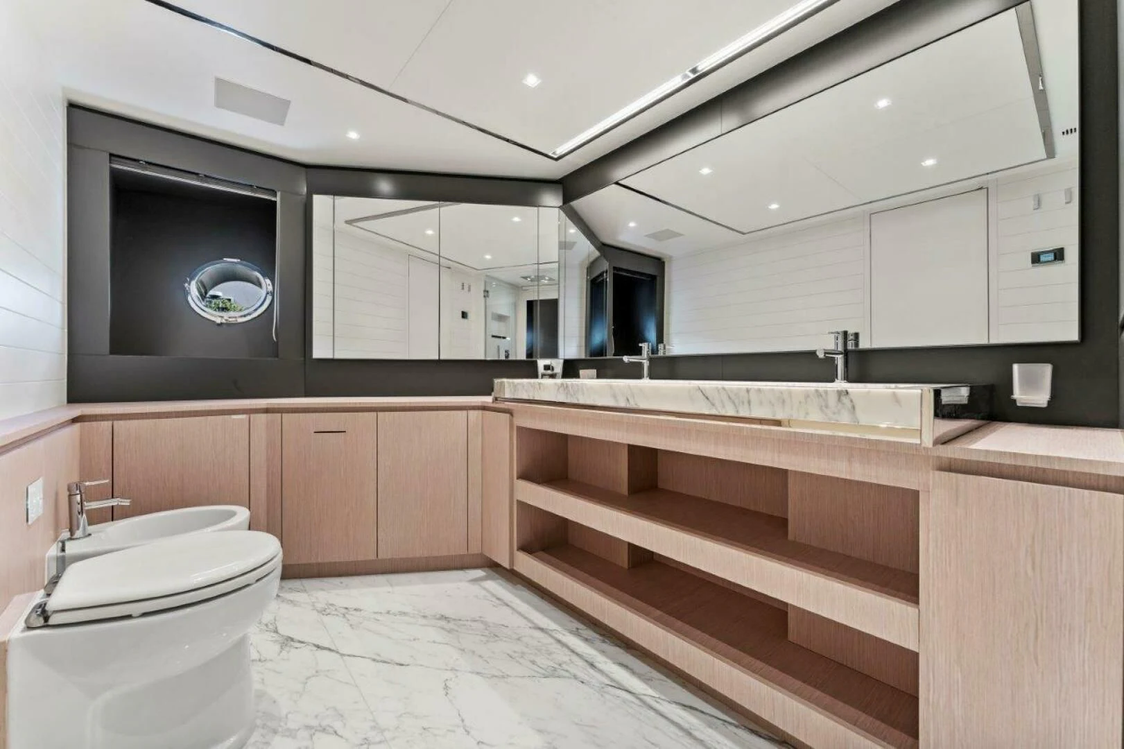 a bathroom with a toilet and cabinets aboard OUR TRADE Yacht for Sale