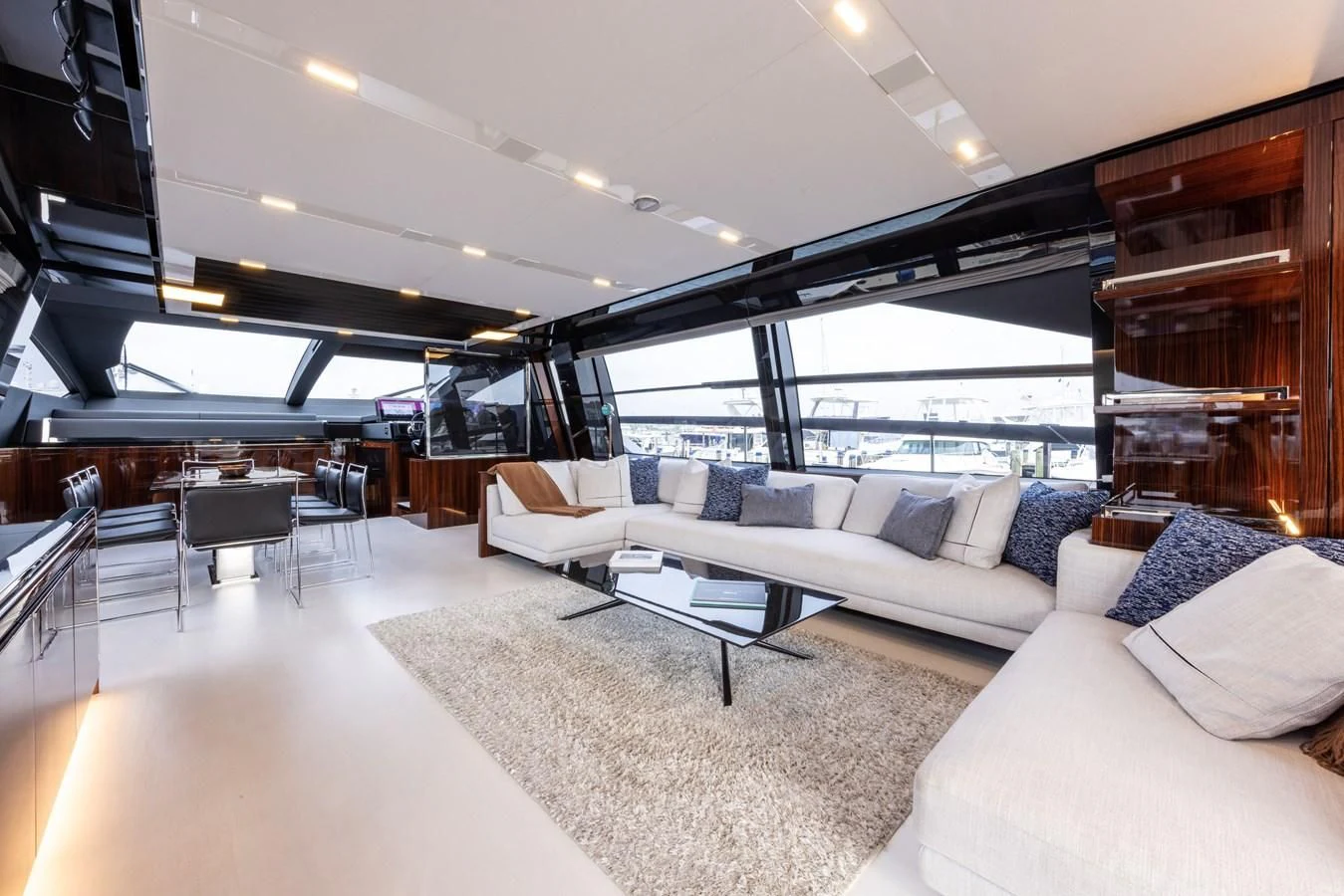 a large living room with a large glass window aboard OUR TRADE Yacht for Sale