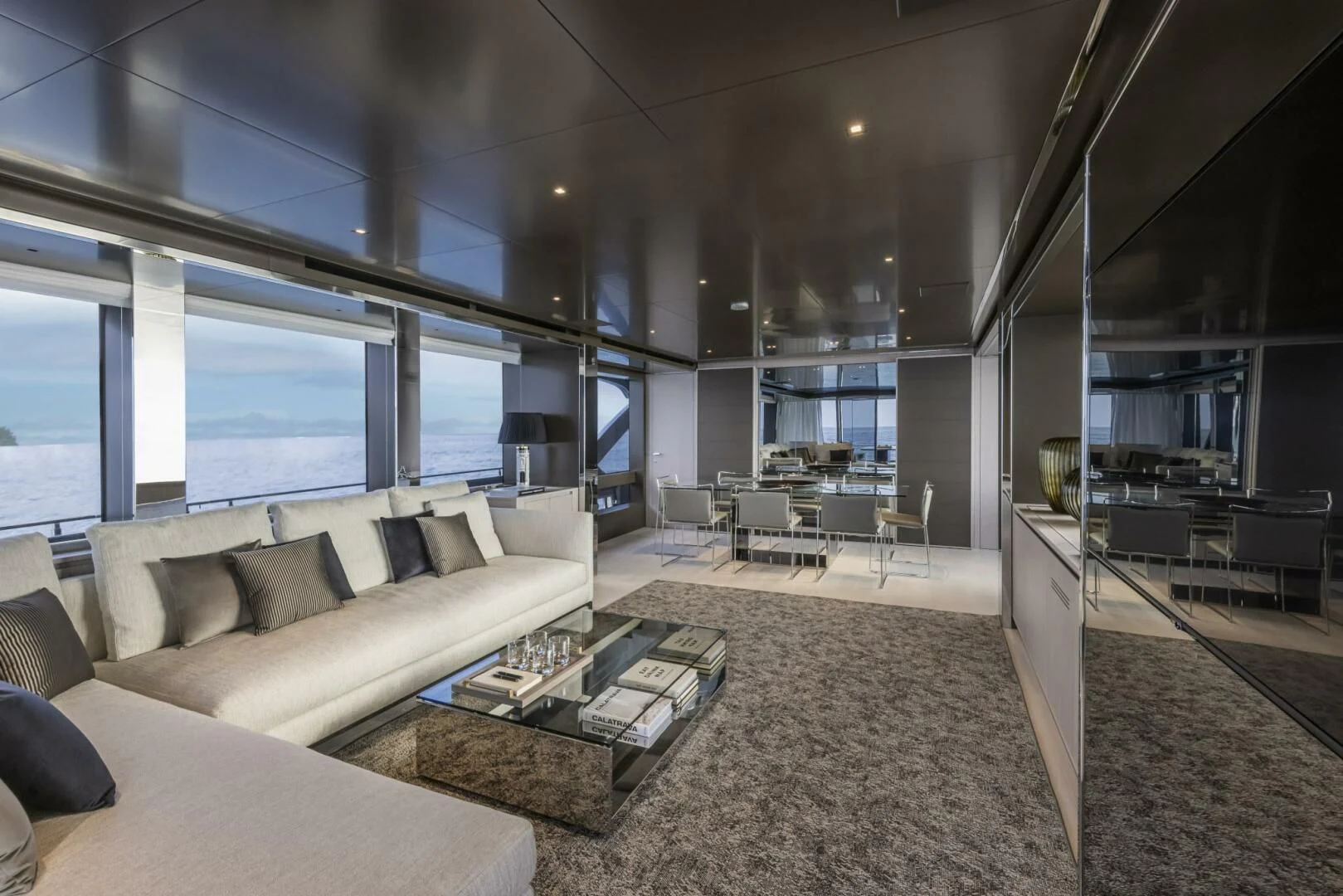 a living room with a large window aboard OUR TRADE Yacht for Sale