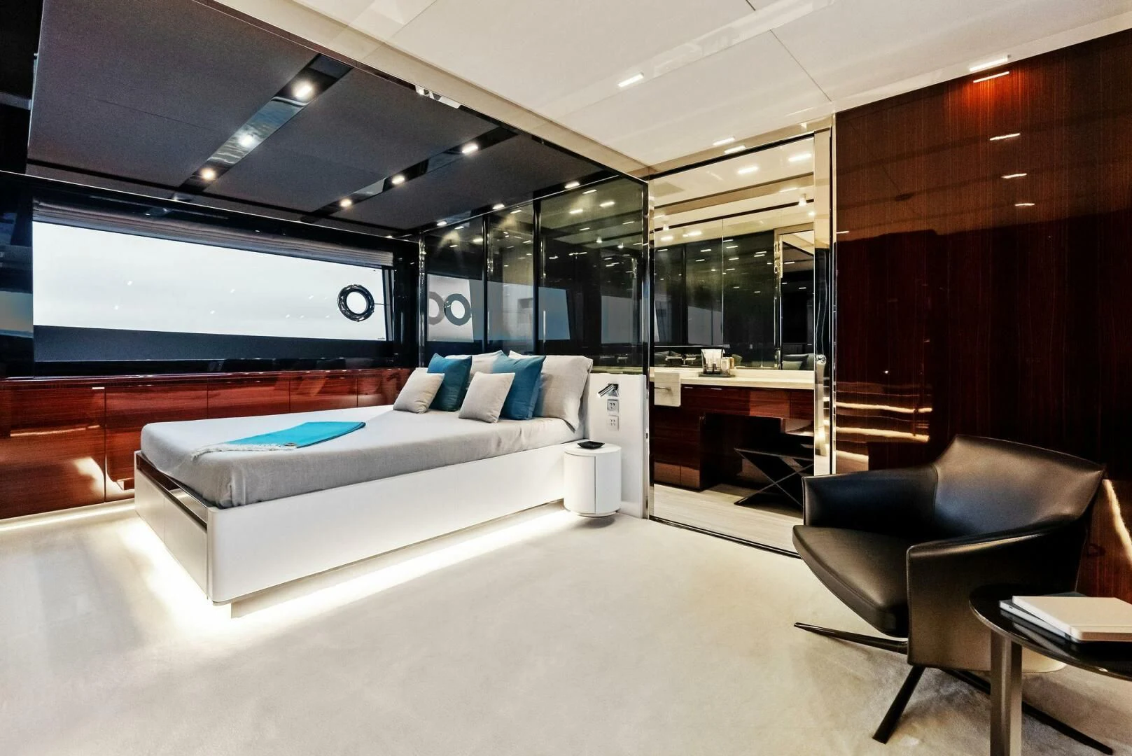 a room with a bed and a chair aboard OUR TRADE Yacht for Sale