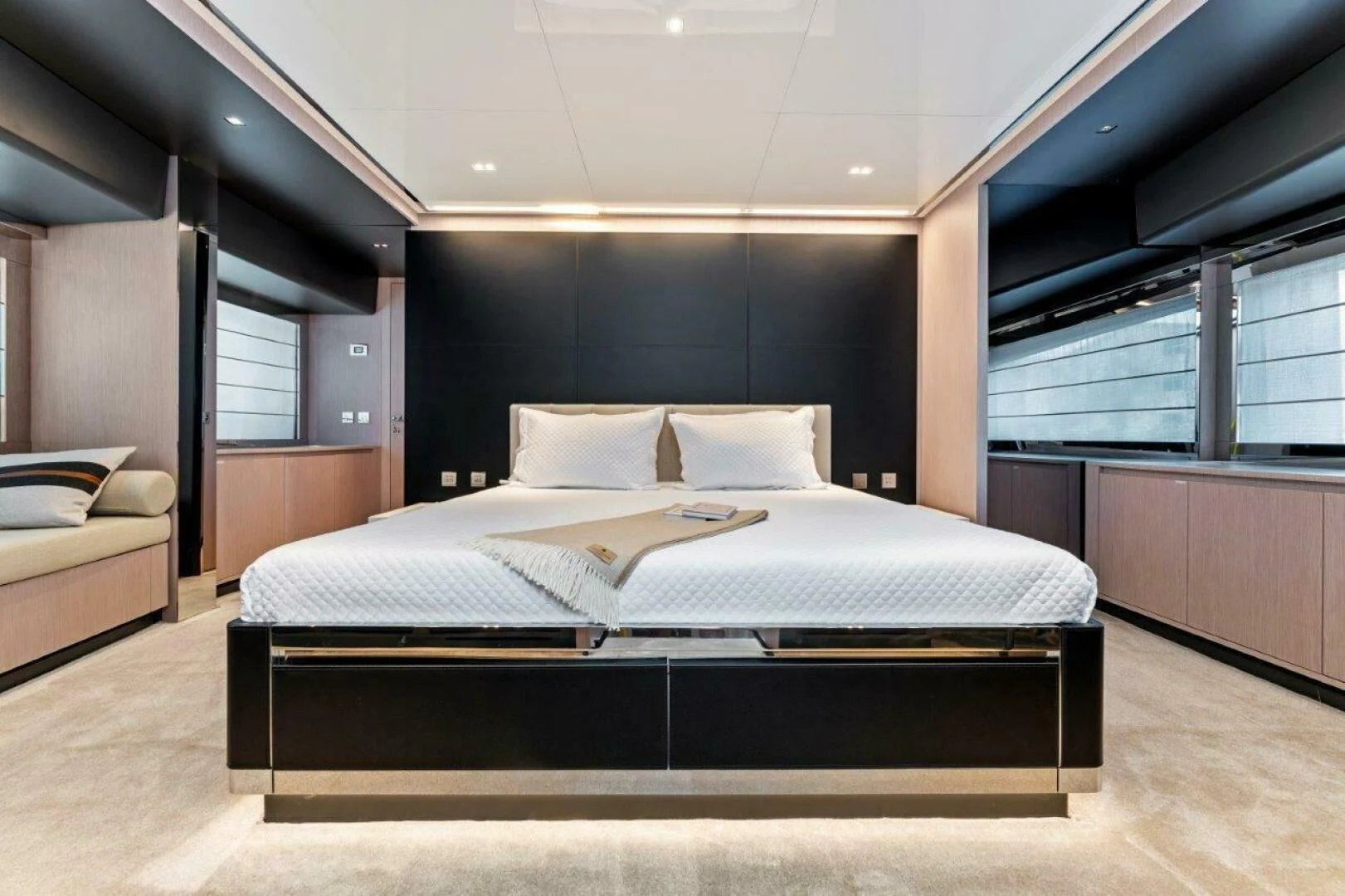 a room with a bed and a window aboard OUR TRADE Yacht for Sale