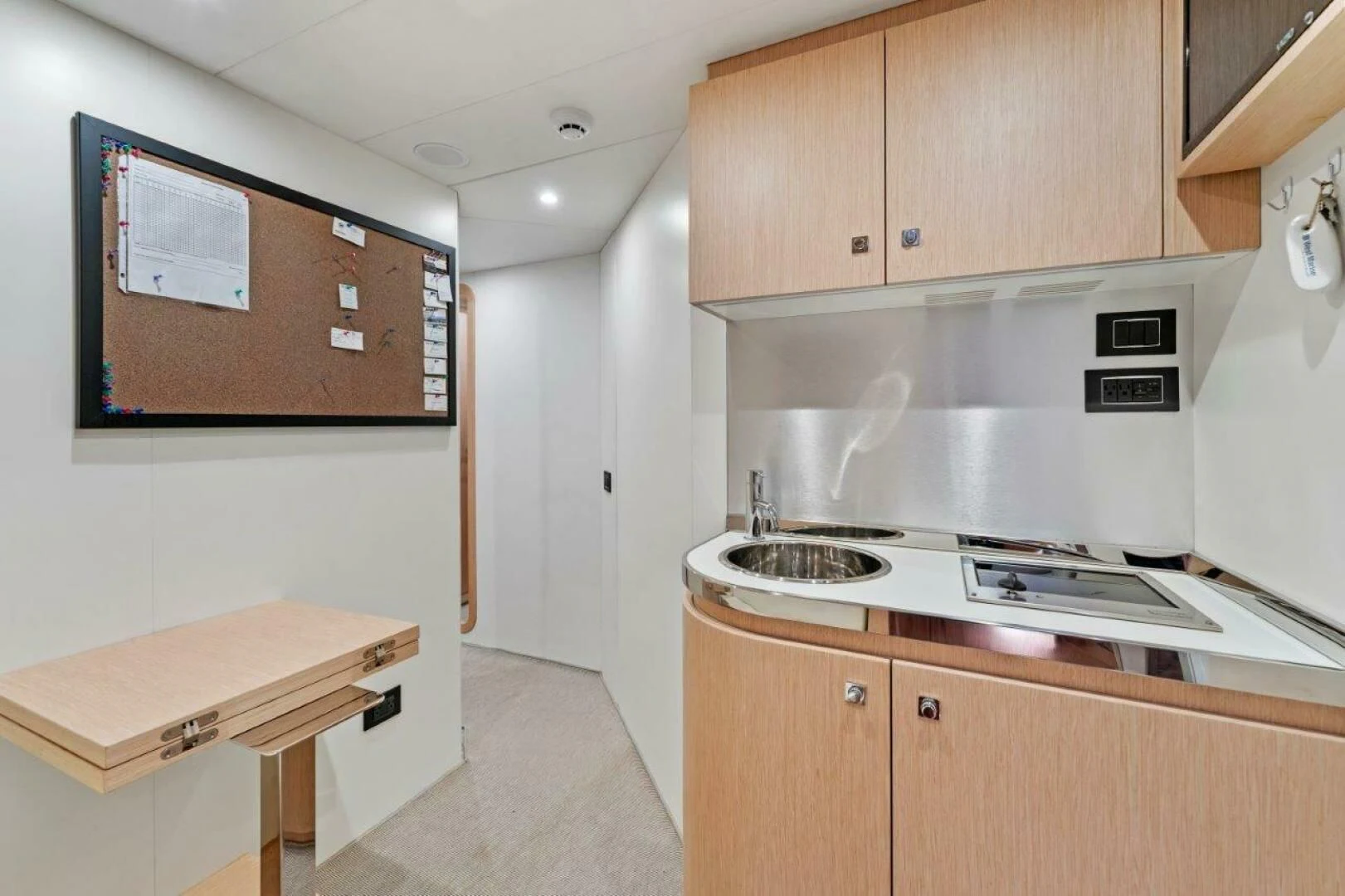 a kitchen with a table and stove aboard OUR TRADE Yacht for Sale