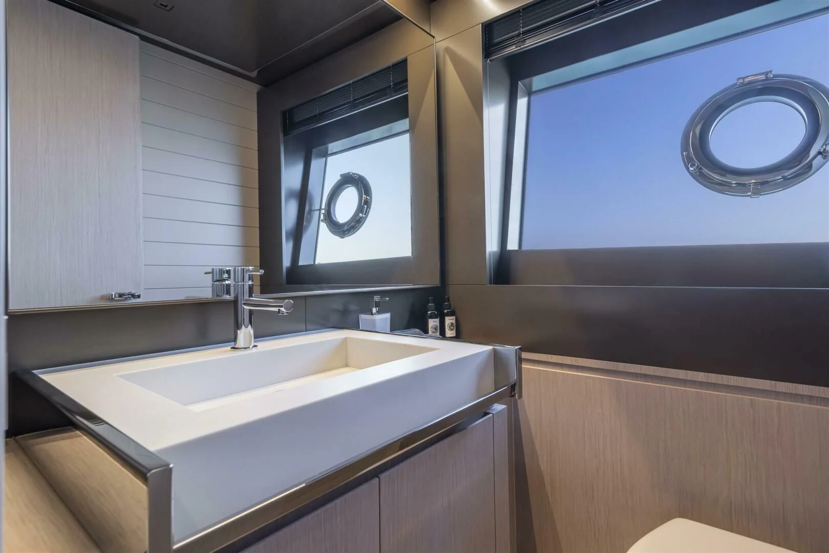 a bathroom with a sink and a mirror aboard OUR TRADE Yacht for Sale
