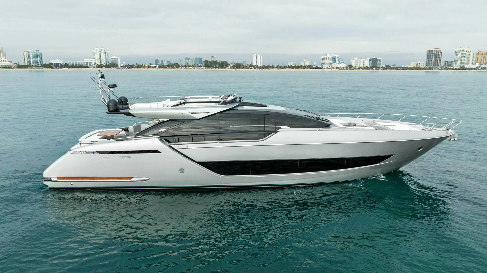 a white yacht in the water aboard OUR TRADE Yacht for Sale