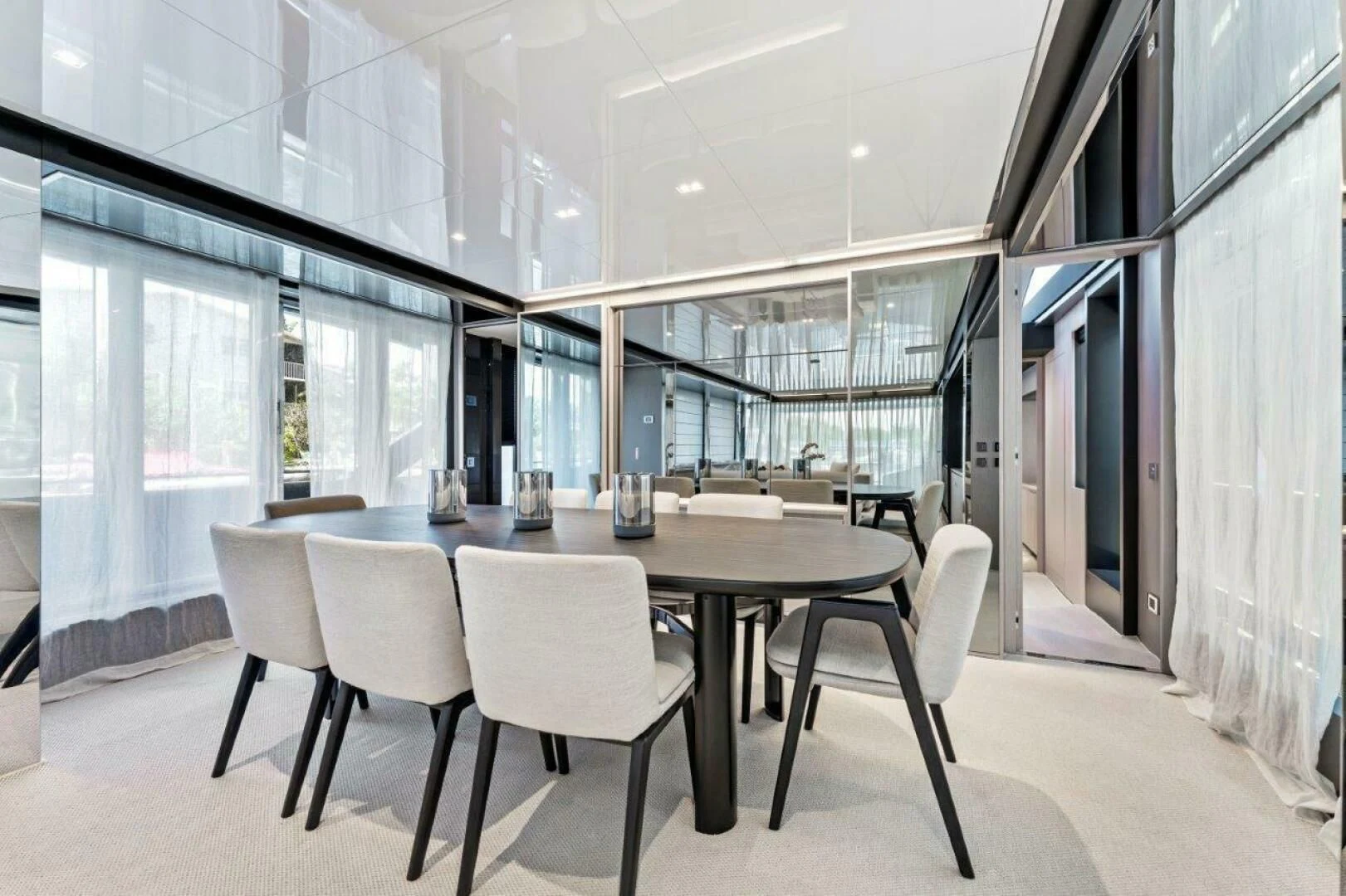 a large room with a table and chairs aboard OUR TRADE Yacht for Sale