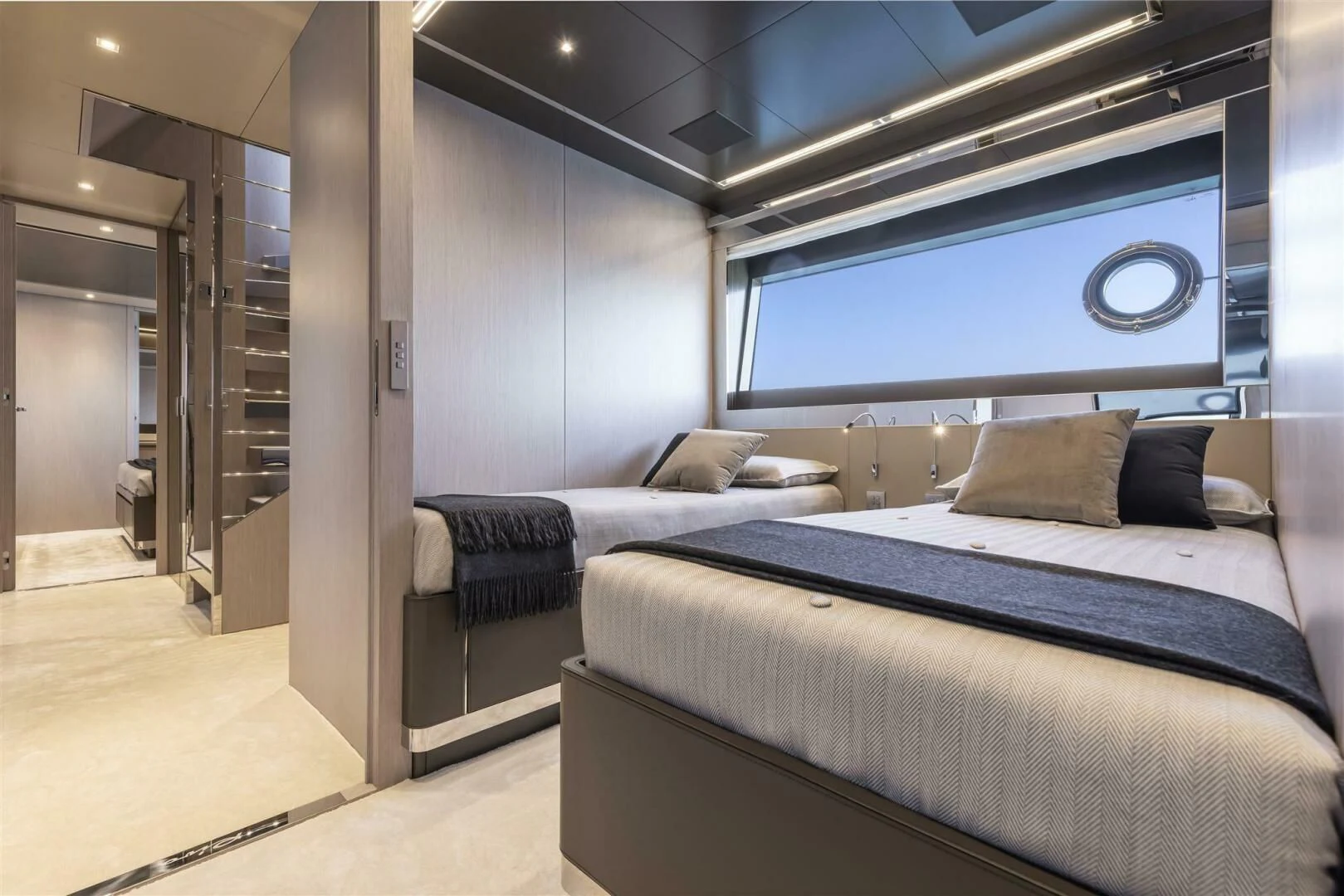 a room with a bed and a large window aboard OUR TRADE Yacht for Sale