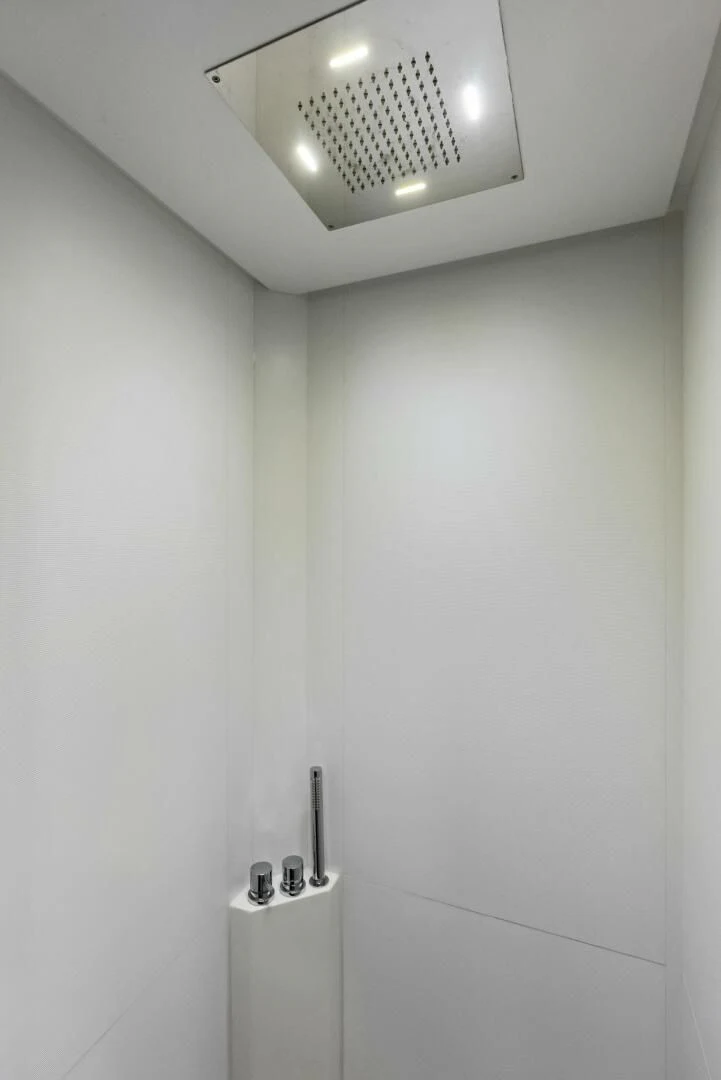 a white wall with a light aboard OUR TRADE Yacht for Sale
