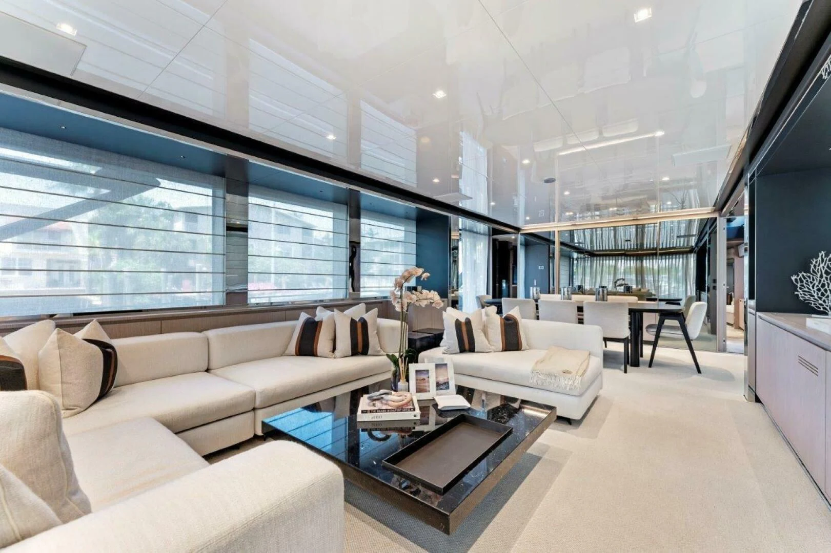 a living room with a large window aboard OUR TRADE Yacht for Sale