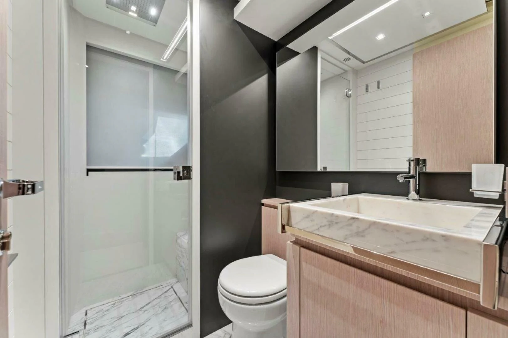 a bathroom with a toilet and a sink aboard OUR TRADE Yacht for Sale