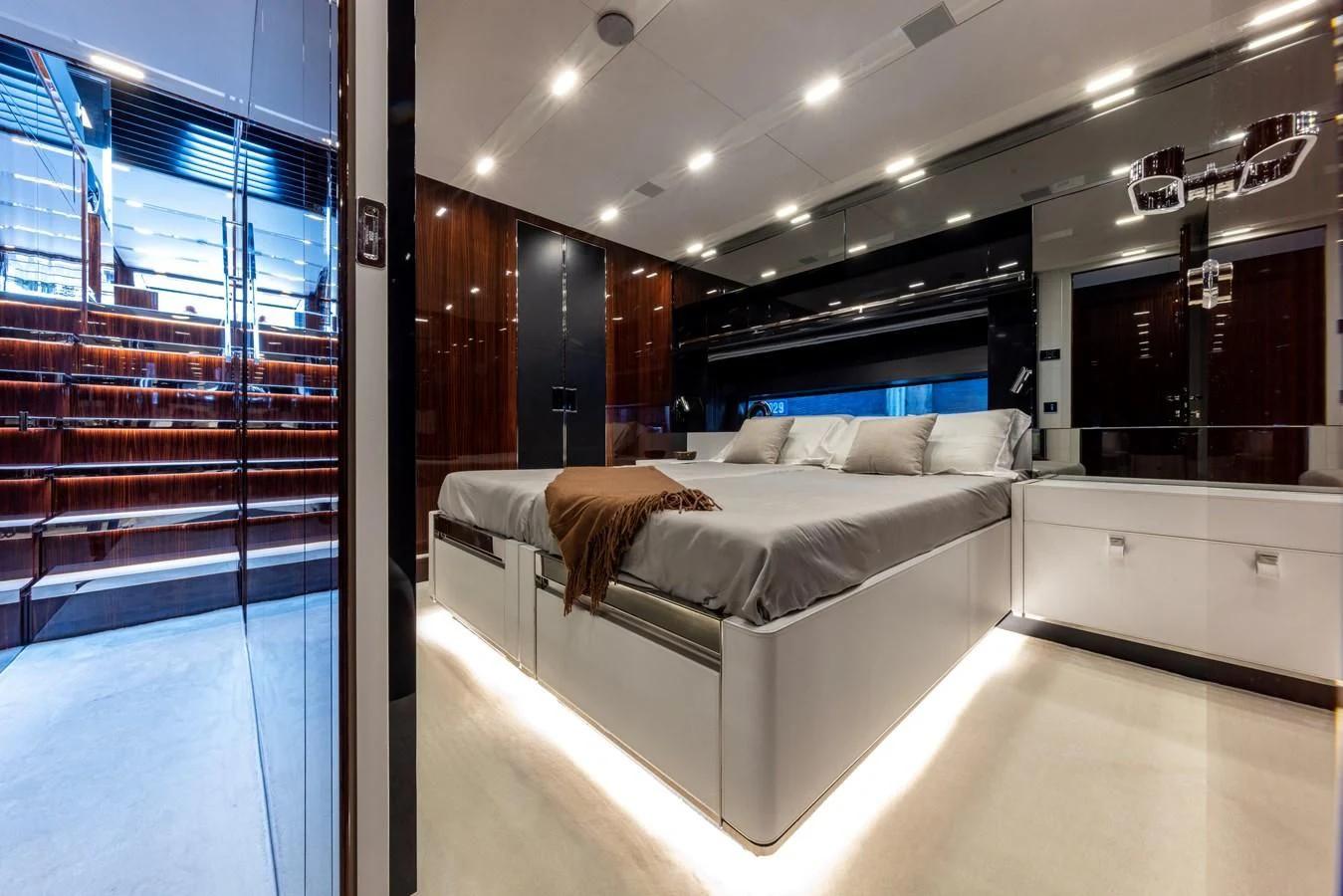 a room with a bed and a window aboard OUR TRADE Yacht for Sale