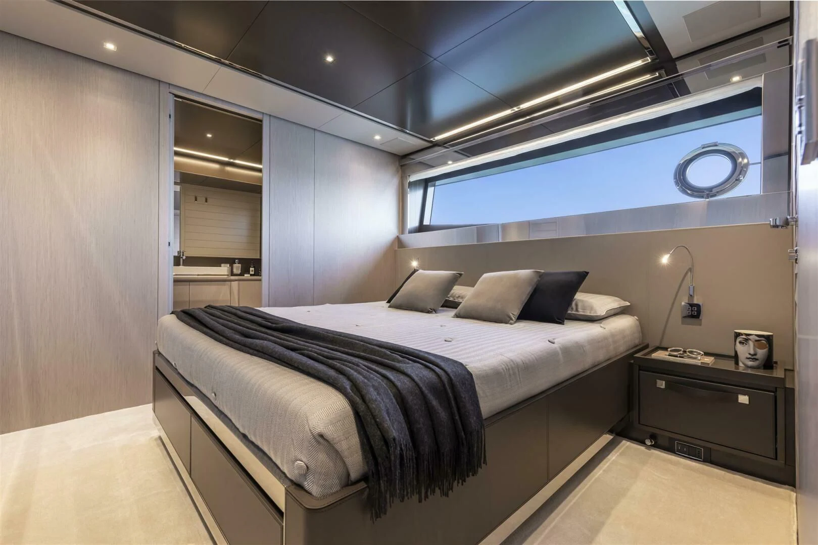a bedroom with a bed and a desk aboard OUR TRADE Yacht for Sale
