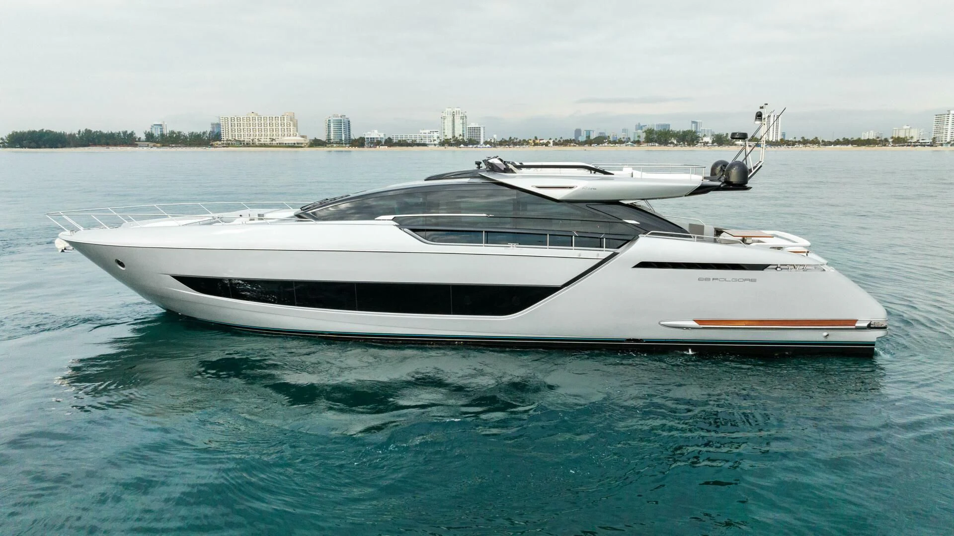 a white boat in the water aboard OUR TRADE Yacht for Sale
