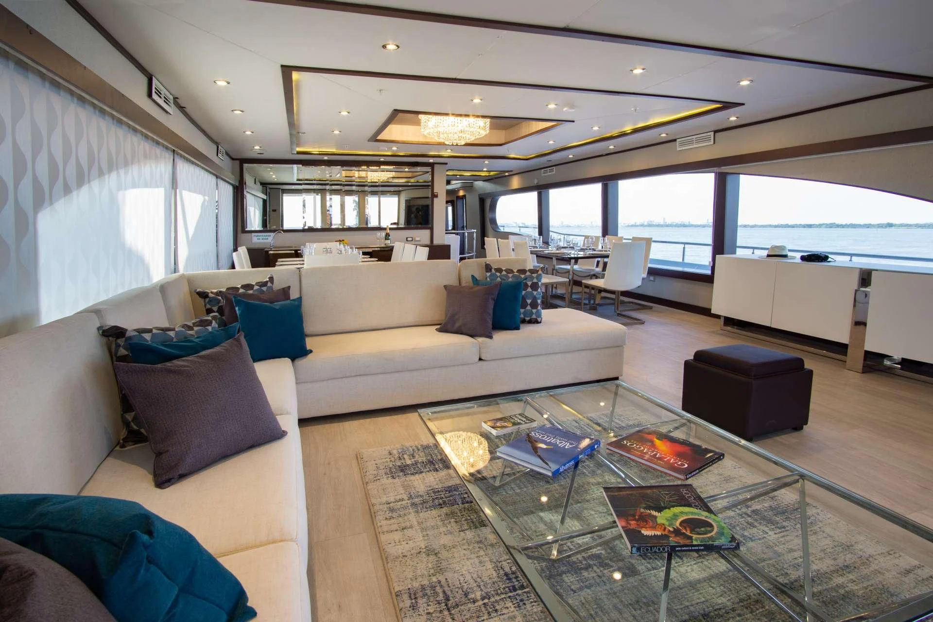 a living room with a large window aboard GRAND MAJESTIC Yacht for Sale