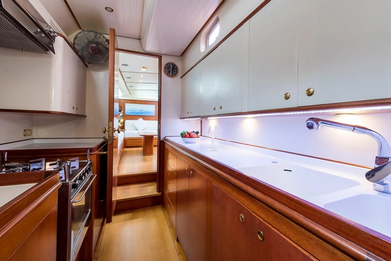 a kitchen with white cabinets aboard ALEXIA Yacht for Sale