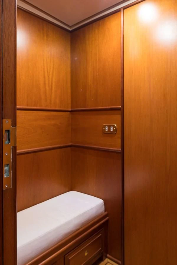 a wooden closet with a bed aboard ALEXIA Yacht for Sale