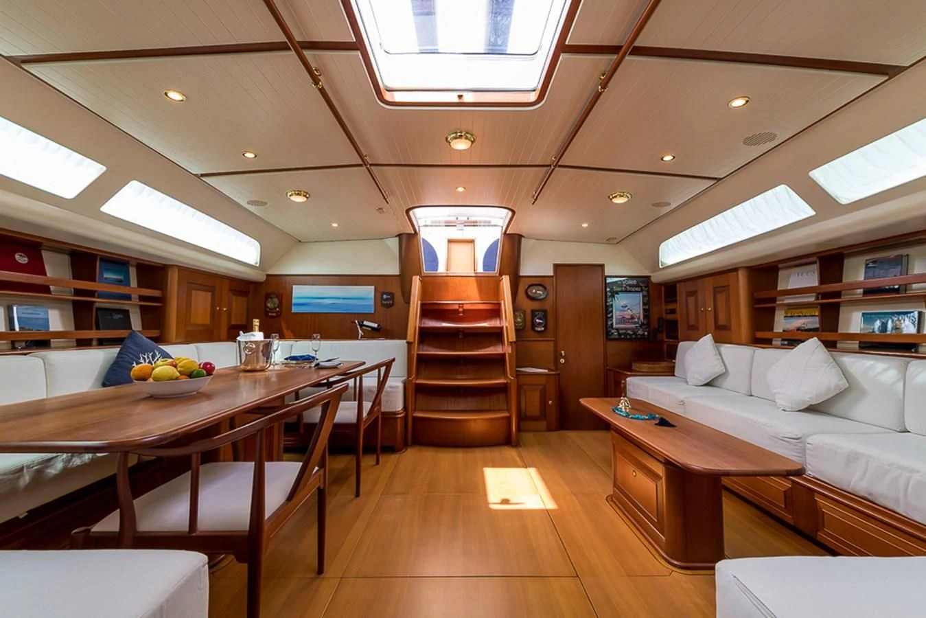 a room with a bunk bed and a table aboard ALEXIA Yacht for Sale