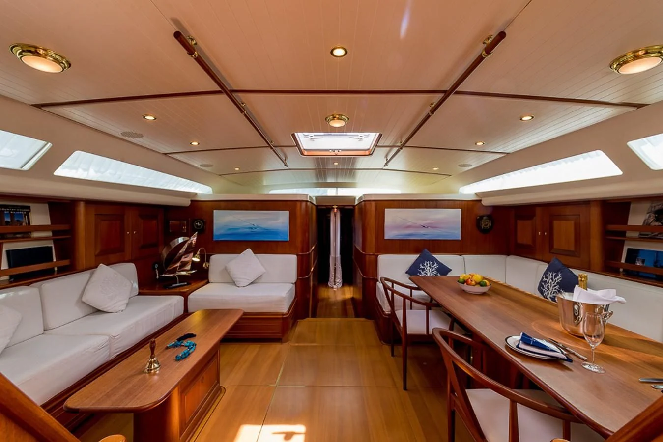 a living room with a wood floor aboard ALEXIA Yacht for Sale