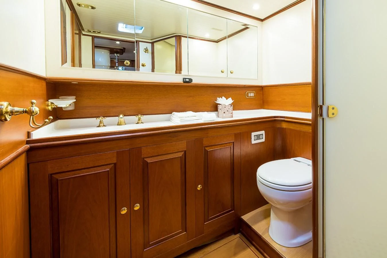 a bathroom with a large mirror aboard ALEXIA Yacht for Sale