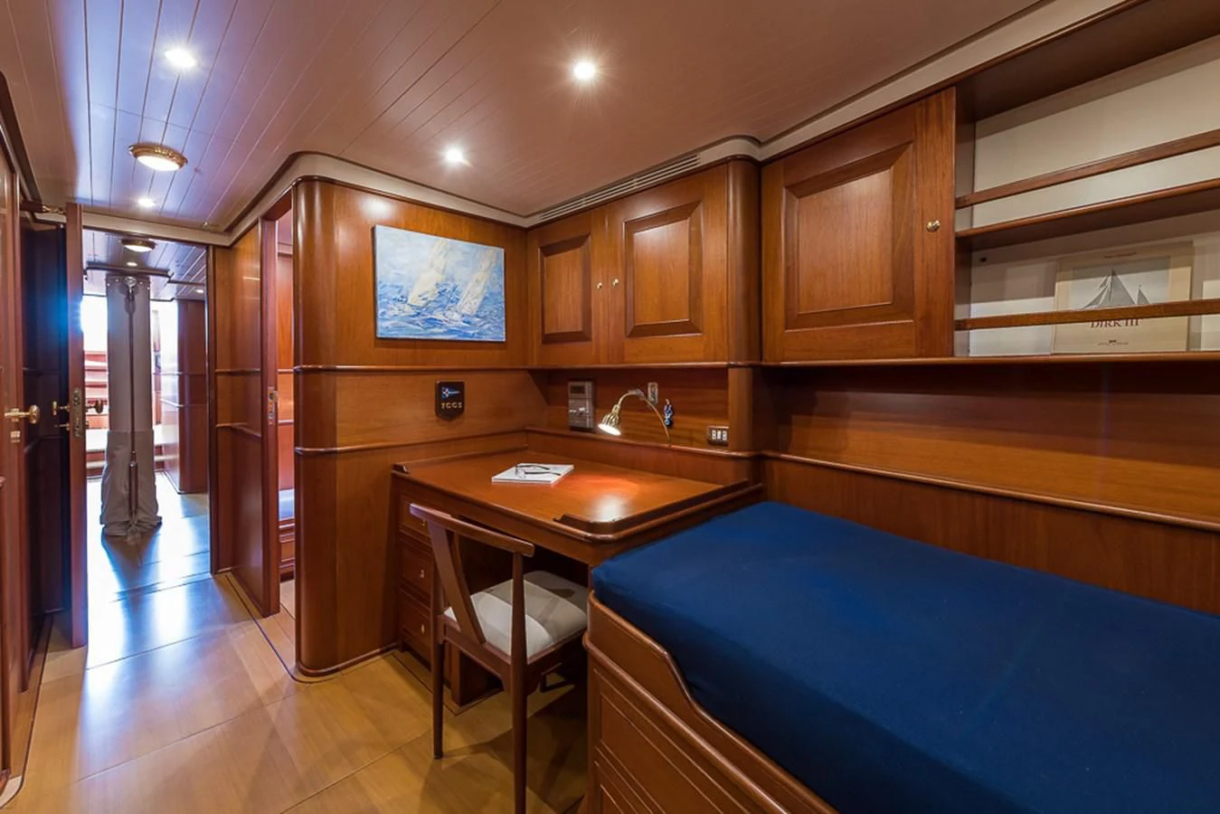 a large kitchen with wooden cabinets aboard ALEXIA Yacht for Sale
