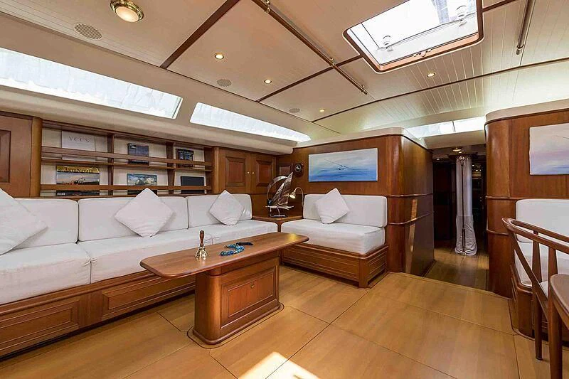 a living room with a couch and a table aboard ALEXIA Yacht for Sale