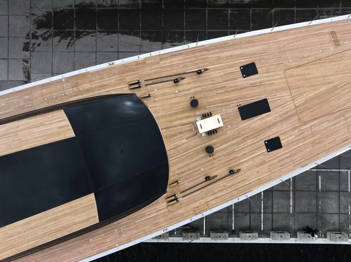 a black circular object on a wooden surface aboard SARISSA Yacht for Sale