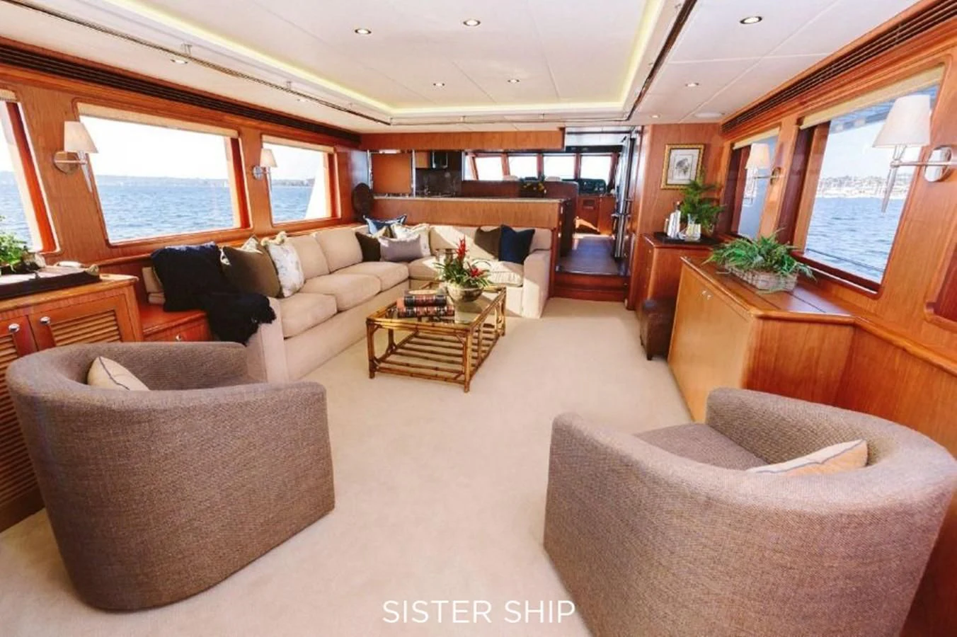 a living room with a couch and a coffee table aboard 880 CPMY Yacht for Sale
