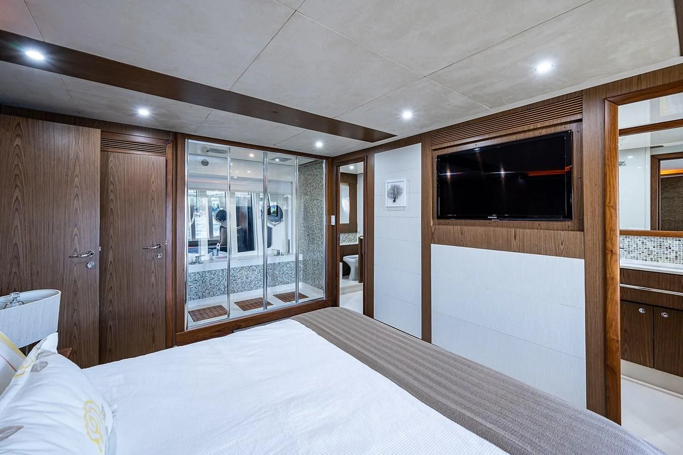 a large bedroom with a large bed aboard FERRETTI Yacht for Sale