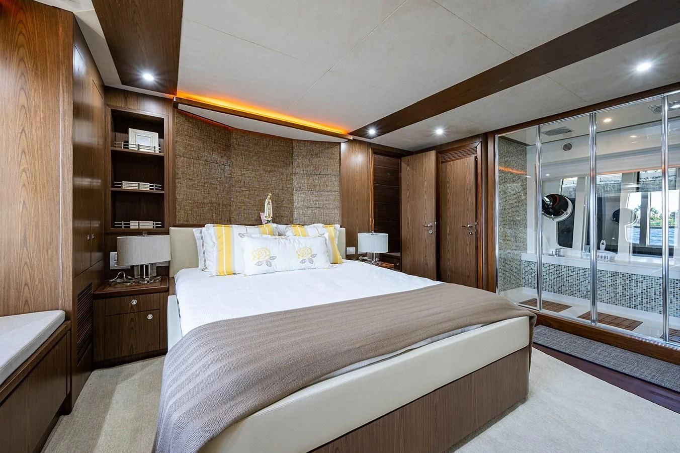 a bedroom with a glass door aboard FERRETTI Yacht for Sale