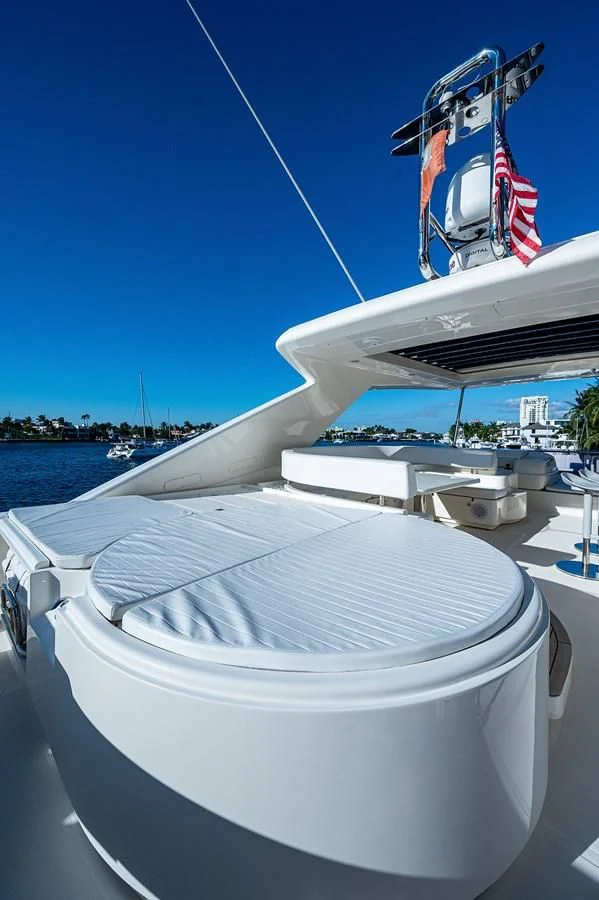 a boat with a flag on it aboard FERRETTI Yacht for Sale