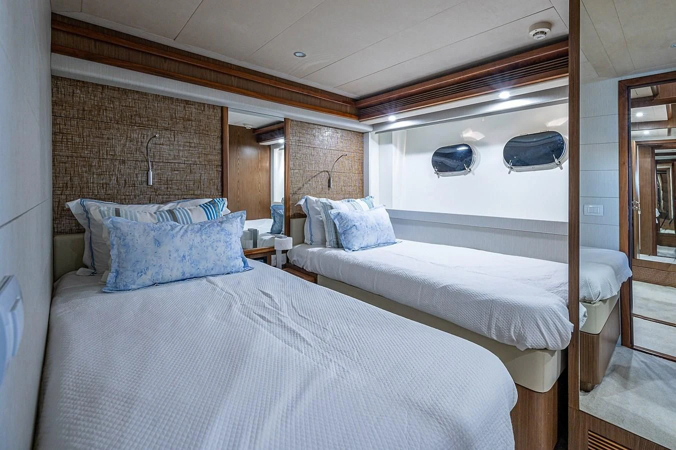 a couple of beds in a room aboard FERRETTI Yacht for Sale