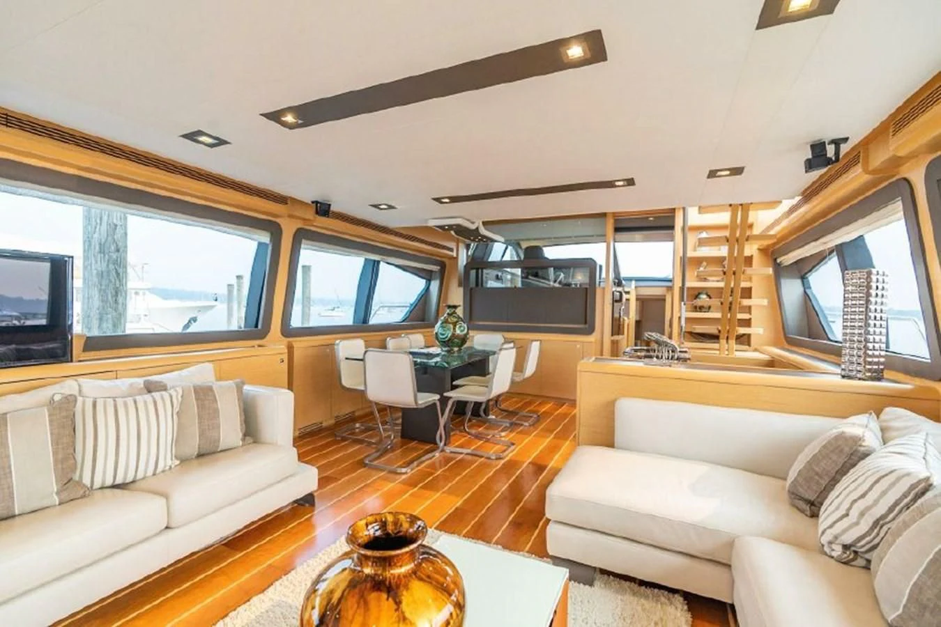 a living room with a large window aboard FERRETTI Yacht for Sale