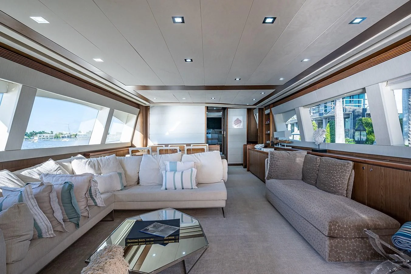 a living room with a couch and a coffee table aboard FERRETTI Yacht for Sale