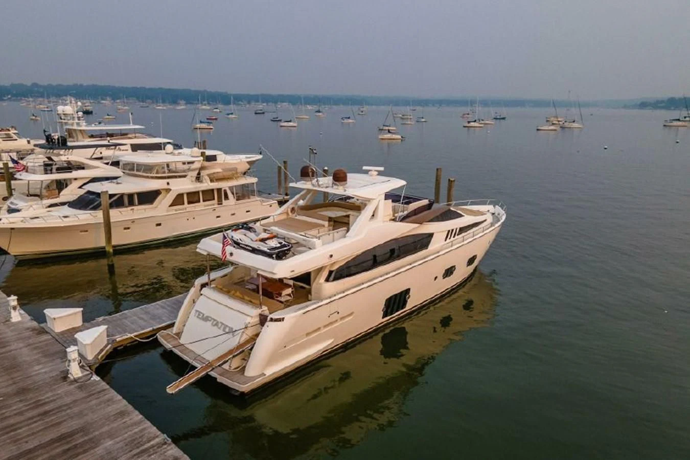 a group of boats are parked in a harbor aboard FERRETTI Yacht for Sale