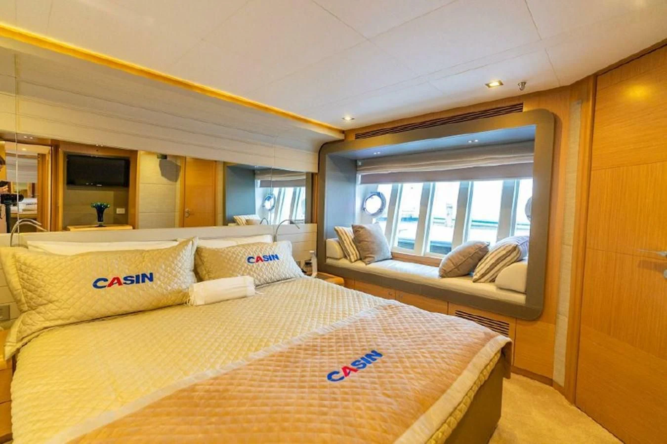 a room with a bed and a large window aboard FERRETTI Yacht for Sale